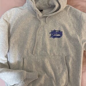 Stussy Light Gray Hoodie with Purple Logo
